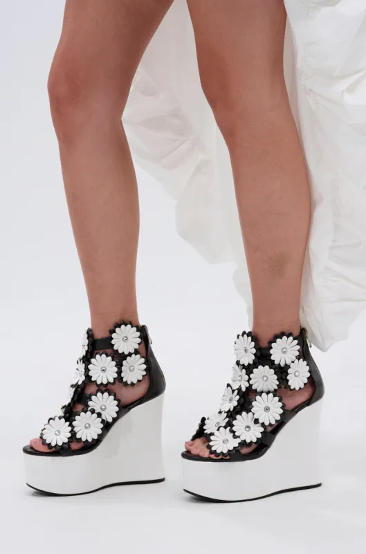 AZALEA WANG FLOWER EMBELLISHED WEDGE SANDAL IN BLACK sold by AKIRA
