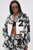 PAINT THE ROSES RED JACQUARD BOMBER sold by AKIRA