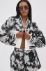 PAINT THE ROSES RED JACQUARD BOMBER sold by AKIRA