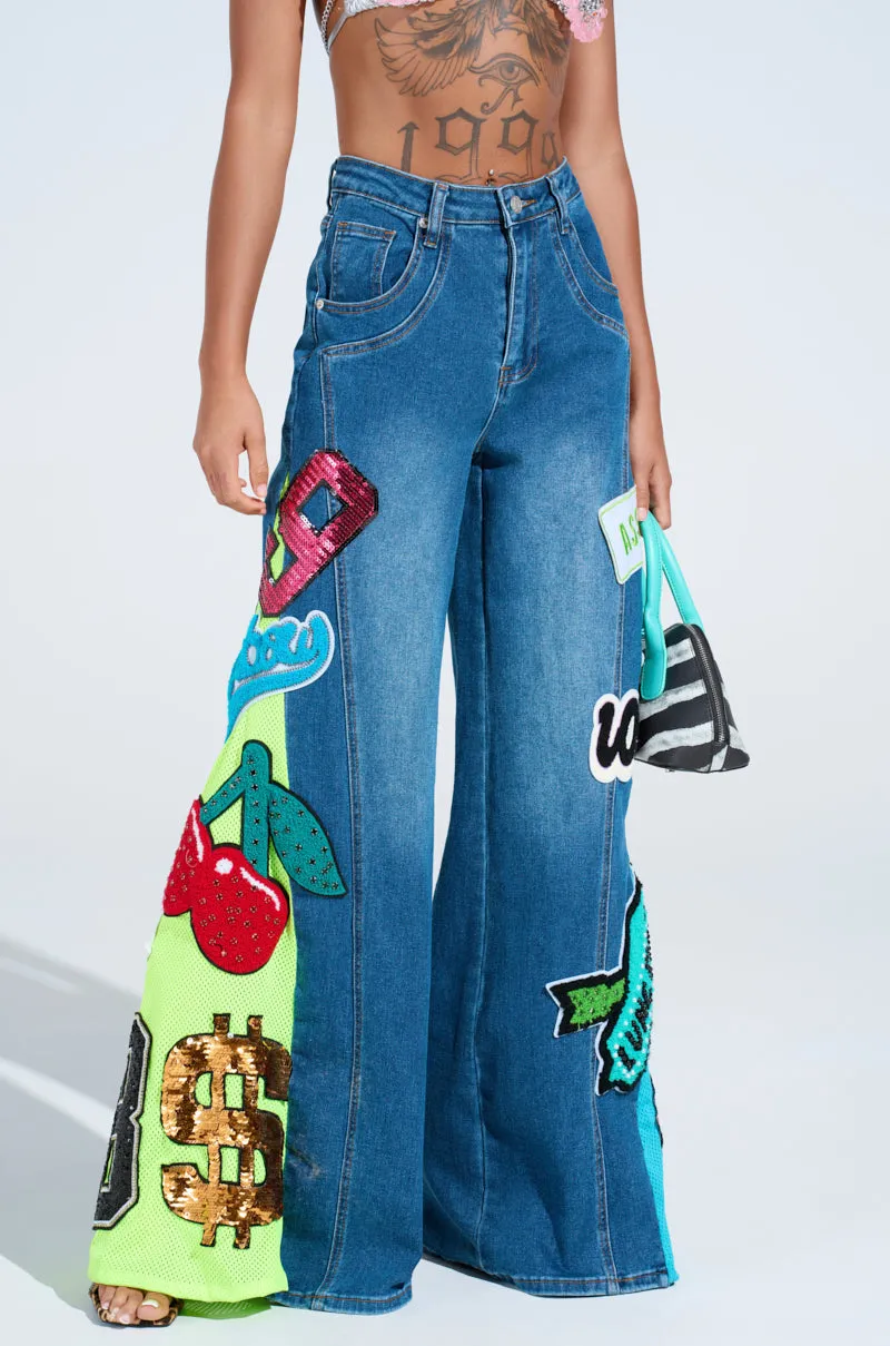 NOT SORRY PATCHWORK MEDIUM BLUE DENIM JEANS sold by AKIRA