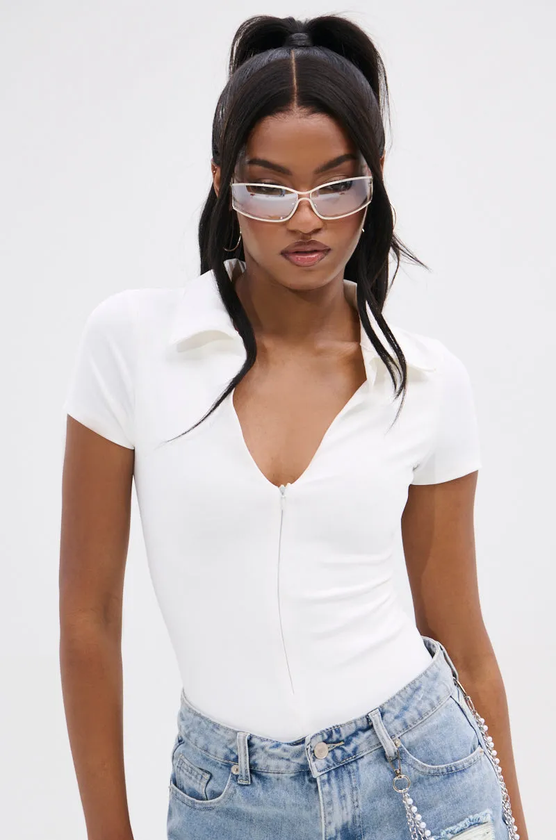 PAXTON FRONT ZIP SHORT SLEEVE COLLARED BODYSUIT sold by AKIRA