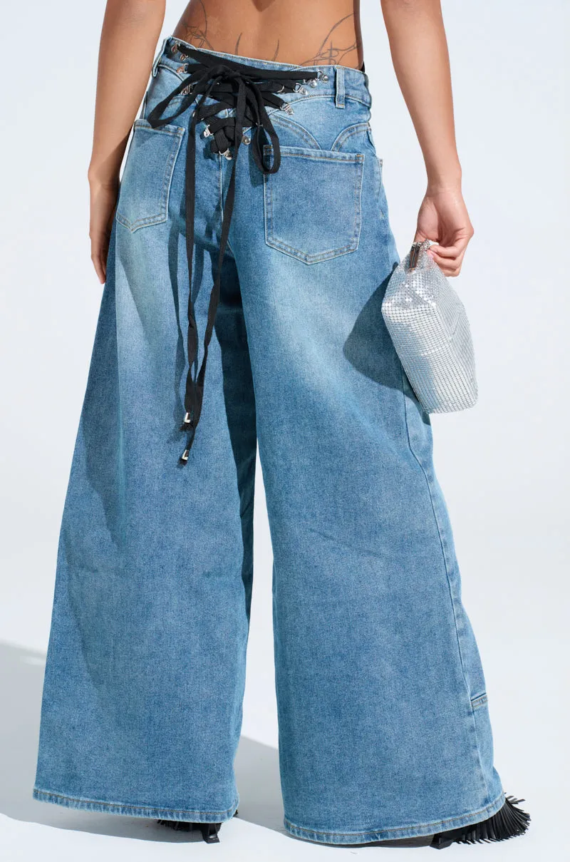 ALIVE AND WELL DENIM PANT WITH LACE UP AT HEM sold by AKIRA