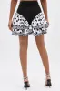 NEED YOU POLKA DOT MINI SKIRT sold by AKIRA