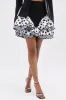 NEED YOU POLKA DOT MINI SKIRT sold by AKIRA