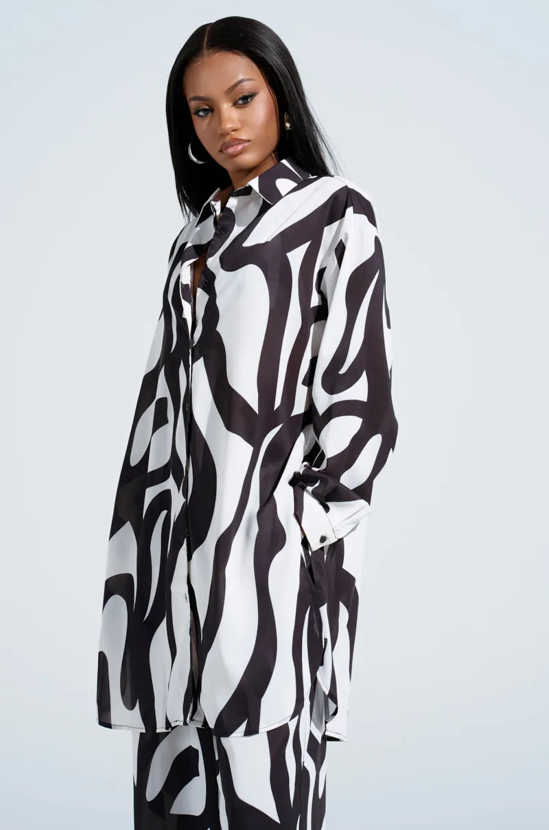 LET IT GO BUTTON DOWN TOP sold by AKIRA