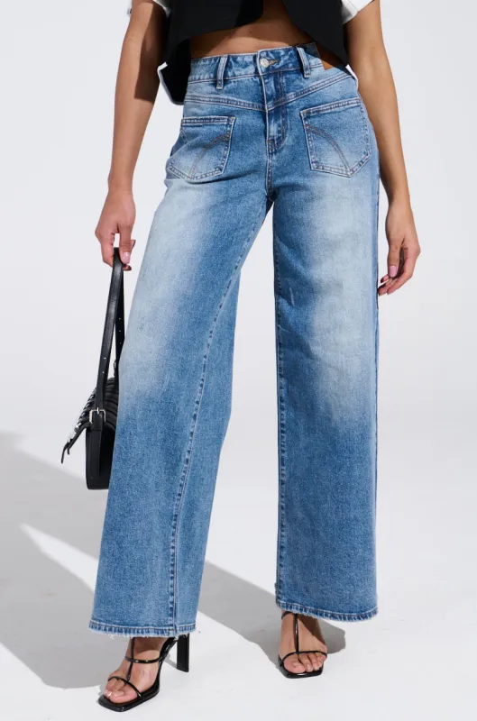 REVERSE REVERSE MEDIUM WASH JEANS sold by AKIRA