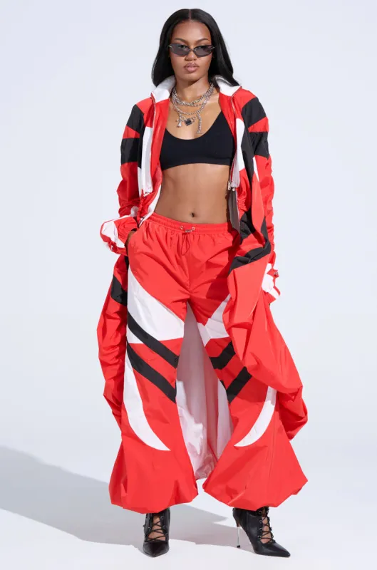 RED ALERT WINDBREAKER JOGGERS sold by AKIRA
