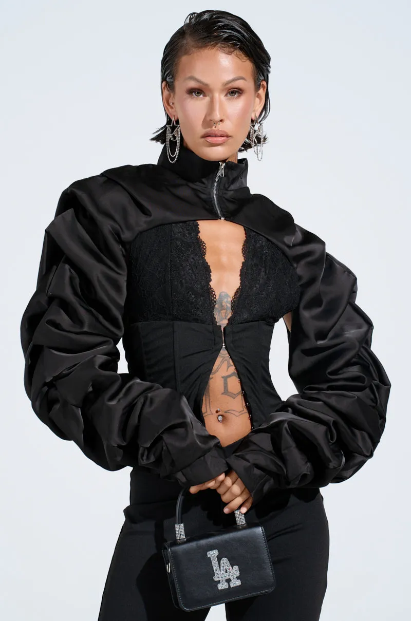 CORA SATIN BOLERO IN BLACK sold by AKIRA