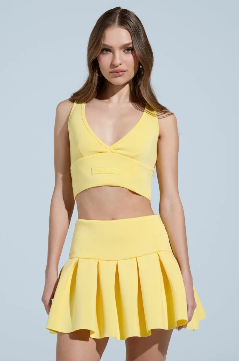 PAXTON SUPERLUXE SLEEVELESS LONGLINE BRALETTE IN YELLOW sold by AKIRA