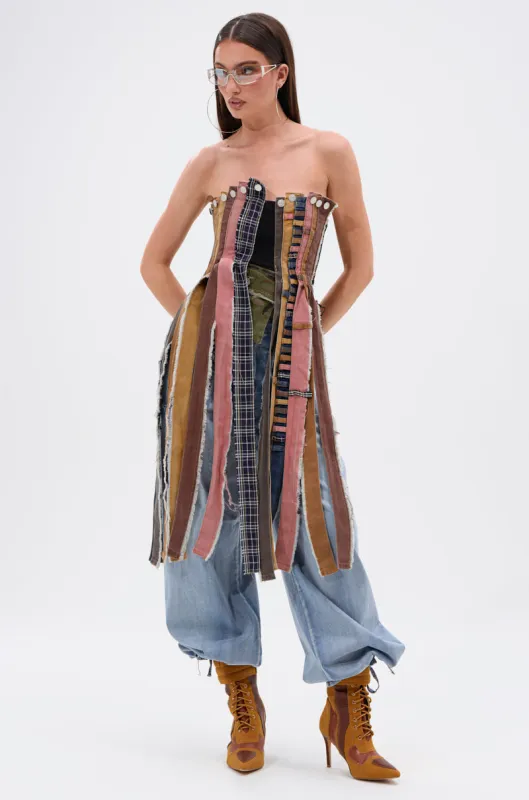 A LOT GOING ON DENIM TOP sold by AKIRA