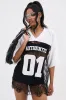 IT GIRL LACE JERSEY DRESS IN WHITE AND BLACK sold by AKIRA