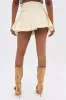 LOVELY DAYS RUFFLE MINI SKIRT IN CREAM sold by AKIRA