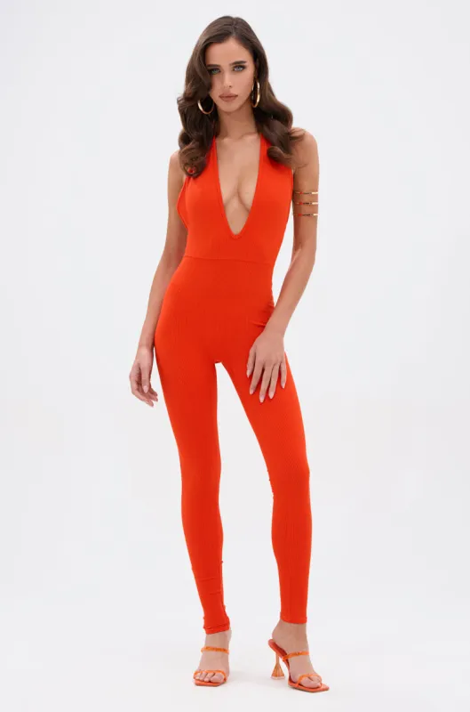 KEEP IT CASUAL HALTER JUMPSUIT IN ORANGE sold by AKIRA