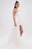 SHE IS THE MOMENT MINI DRESS WITH TRAIN IN WHITE sold by AKIRA