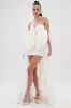 SHE IS THE MOMENT MINI DRESS WITH TRAIN IN WHITE sold by AKIRA