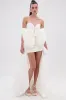 SHE IS THE MOMENT MINI DRESS WITH TRAIN IN WHITE sold by AKIRA