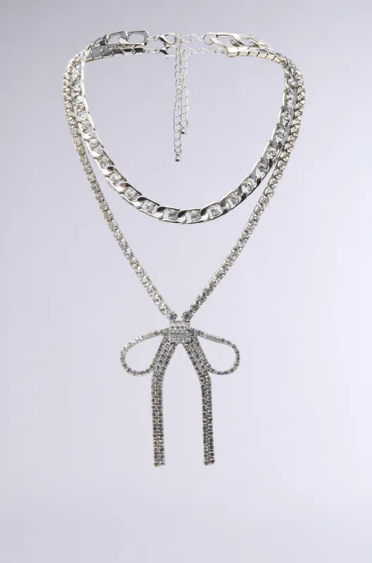 WITH A BOW SILVER NECKLACE SET sold by AKIRA