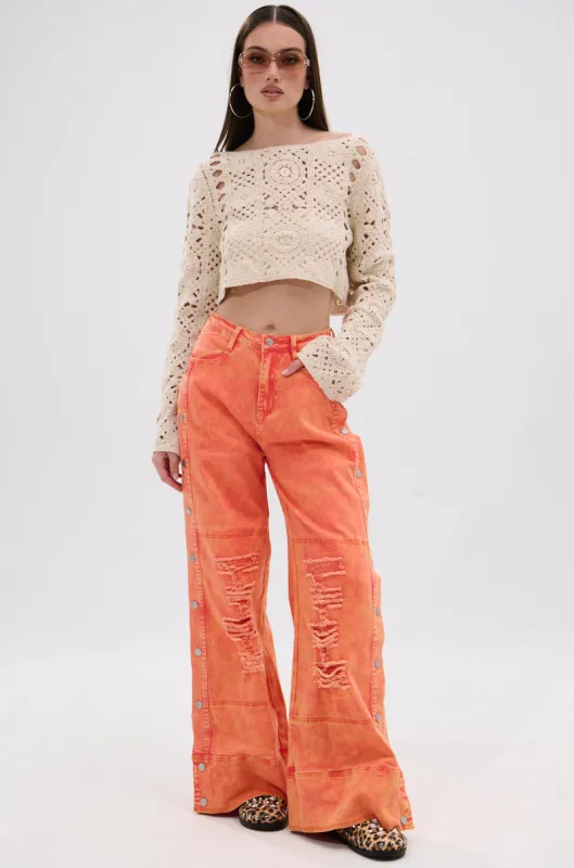ABOVE AVERAGE DISTRESSED SIDE SNAP JEANS sold by AKIRA