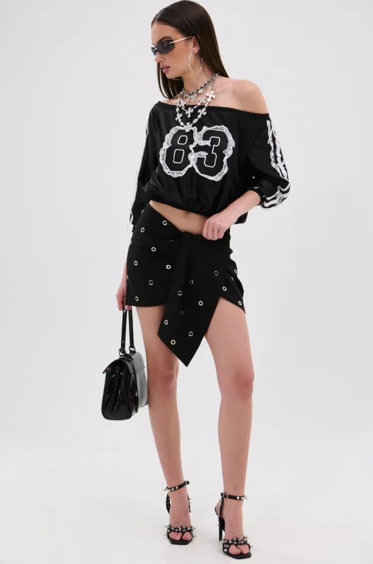 SOMETHING DIFFERENT MINI SKIRT WITH GROMMET sold by AKIRA