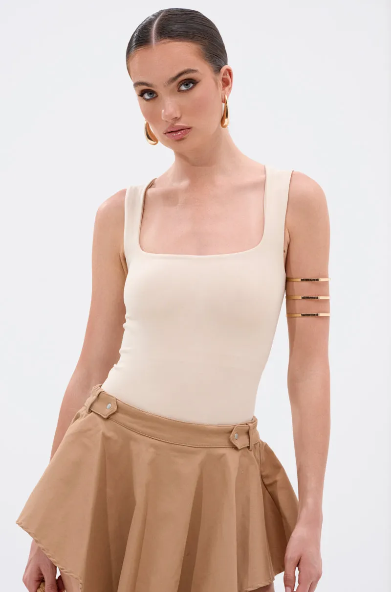 NEW STANDARD SQUARE NECK SLEEVELESS BODYSUIT IN BEIGE sold by AKIRA