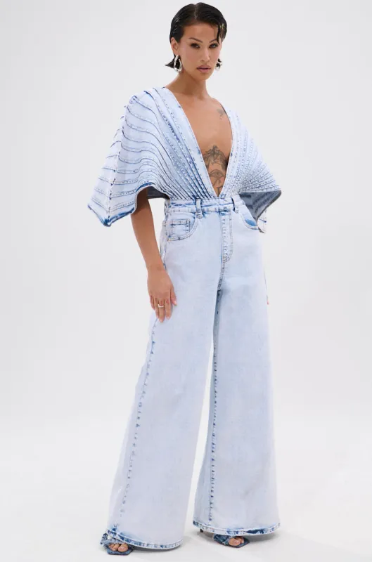 BORN TO STAND OUT DENIM JUMPSUIT sold by AKIRA