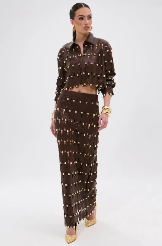 SNEAK PEEK STUDDED PU MIDI SKIRT IN BROWN sold by AKIRA