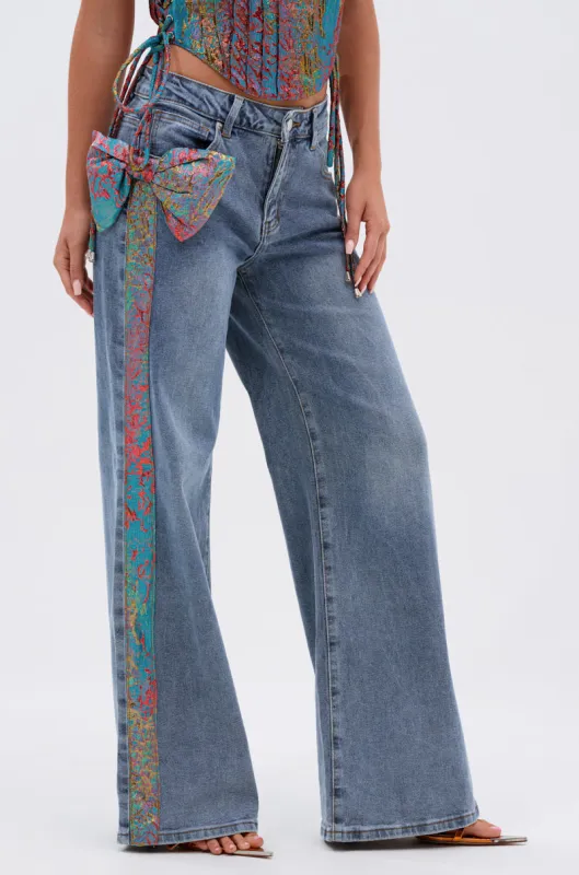 PRETTY GIRL PROBLEMS DENIM WITH BOW sold by AKIRA