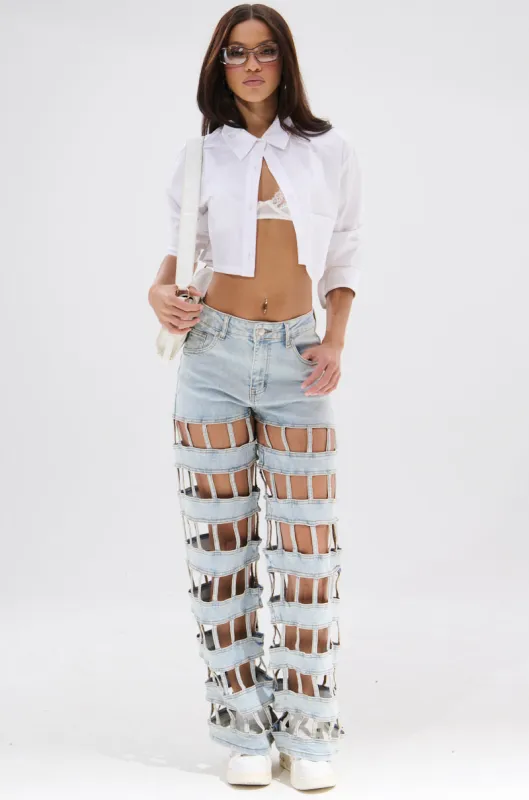 CAGED WIDE LEG DENIM sold by AKIRA