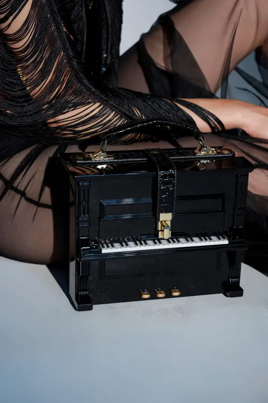 PLAY ME PIANO PURSE sold by AKIRA