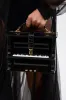 PLAY ME PIANO PURSE sold by AKIRA