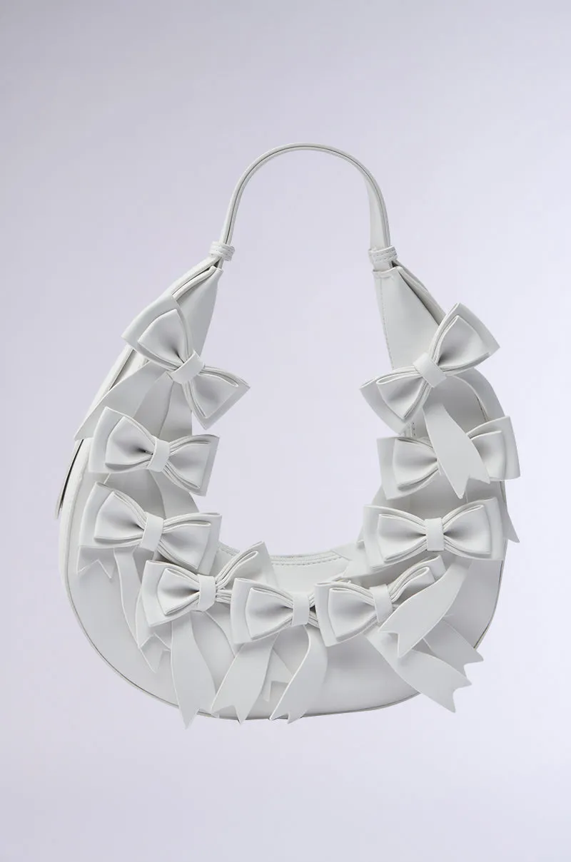 TIE IT WITH A BOW PURSE sold by AKIRA