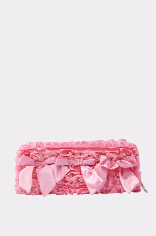 WITH A BOW CLUTCH sold by AKIRA