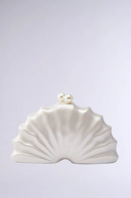 IN TULUM CLUTCH sold by AKIRA