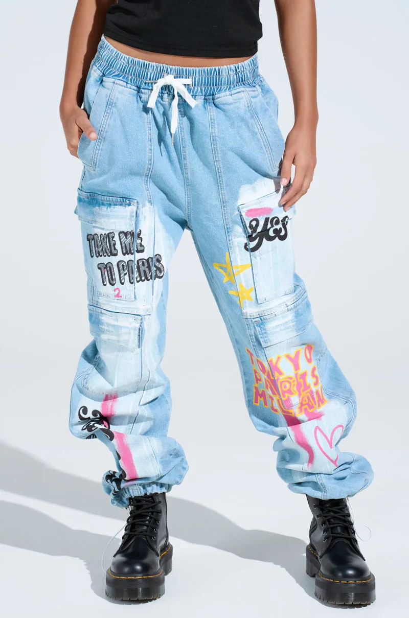 FIRST CLASS TICKET GRAPHIC CARGO RELAXED LEG JEANS sold by AKIRA