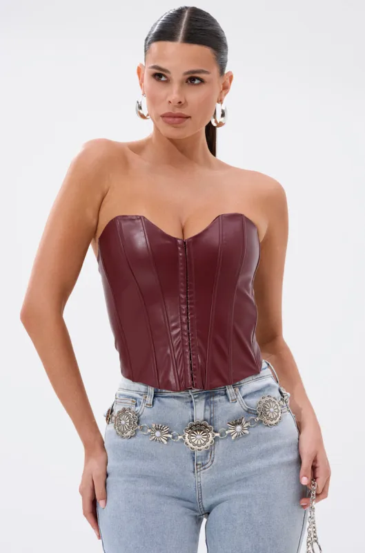 BACK IT UP CORSET TOP IN BURGUNDY sold by AKIRA