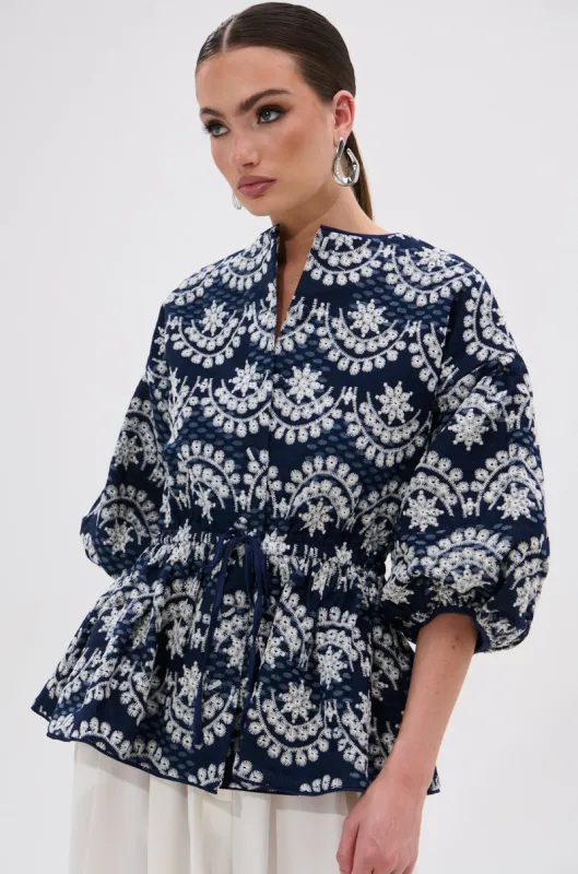 MELODY DENIM EYELET BLOUSE sold by AKIRA