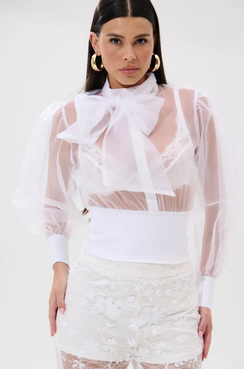 DANCE AND SHAKE BLOUSE WITH BOW IN WHITE sold by AKIRA