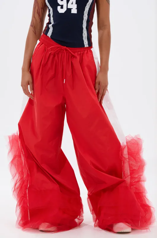 FEELING LIKE A BOSS TRACK PANT WITH TULLE TRIM IN RED sold by AKIRA