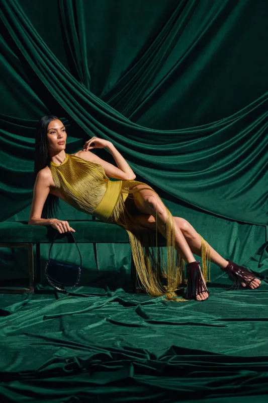 RENEE FRINGE ROMPER IN GREEN made by AKIRA