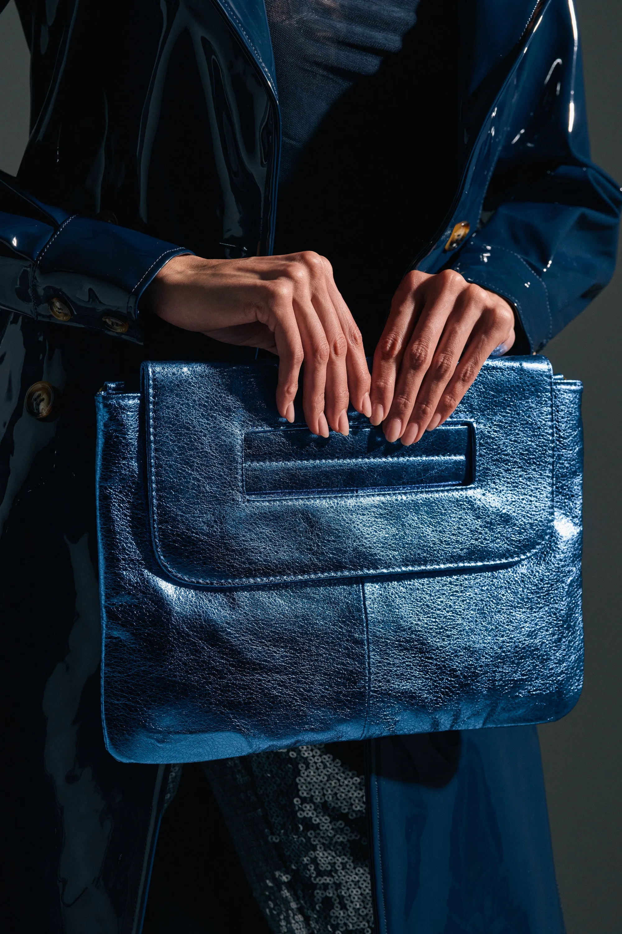 COSMIC COBALT OVERSIZED CLUTCH sold by AKIRA
