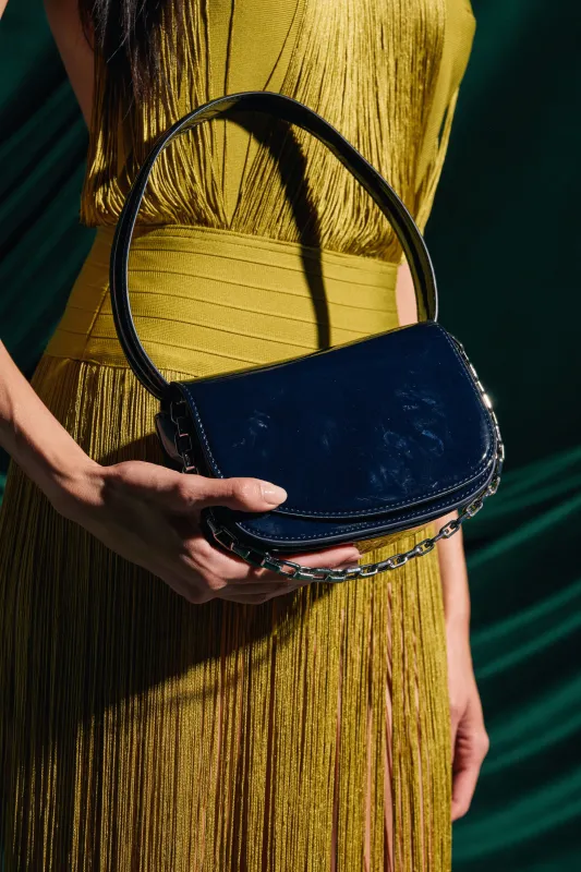 WITH IT PATENT PURSE sold by AKIRA