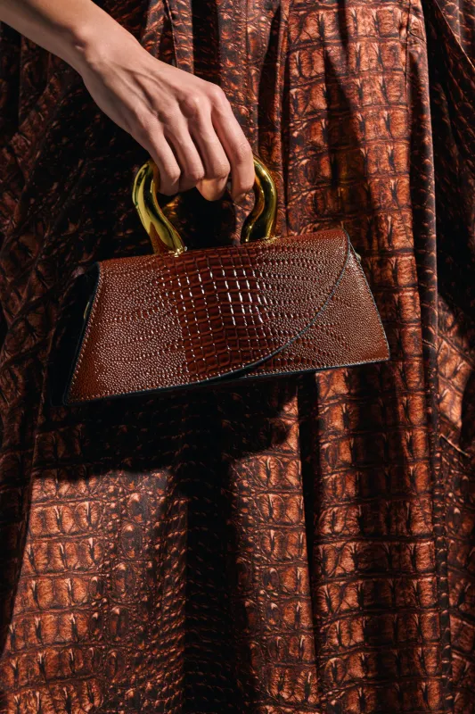 DOESNT DESERVE ME PURSE sold by AKIRA