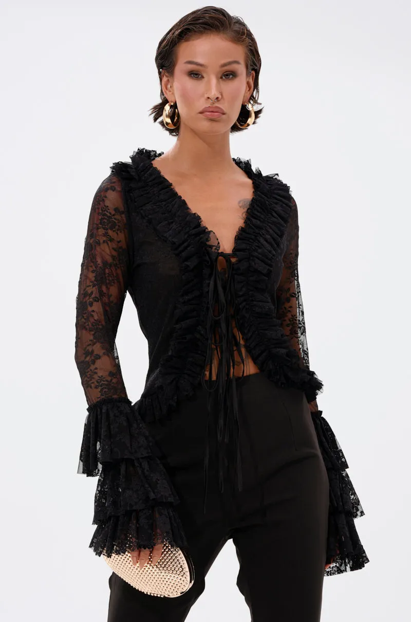 AN ELEGANT AFFAIR RUFFLE LACE BLOUSE IN BLACK sold by AKIRA