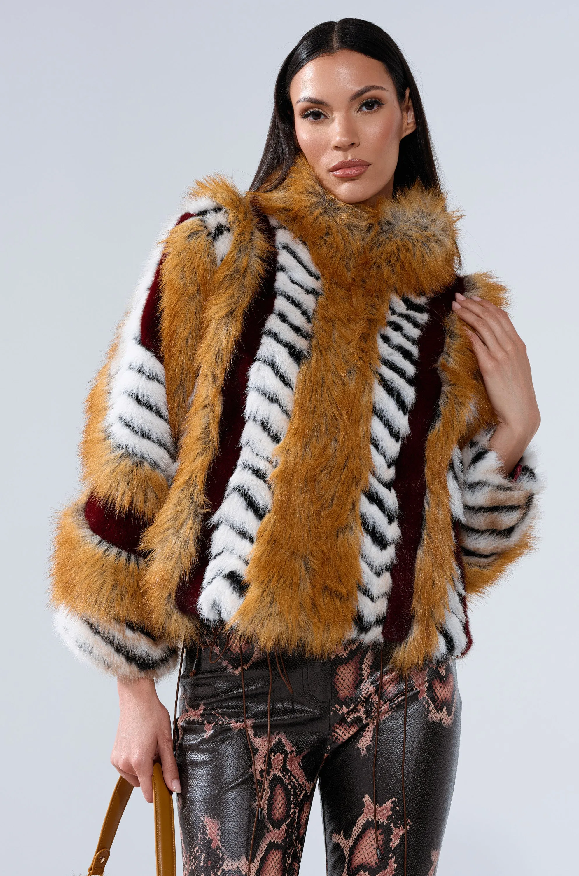 OLYMPIA PANELED FAUX FUR sold by AKIRA