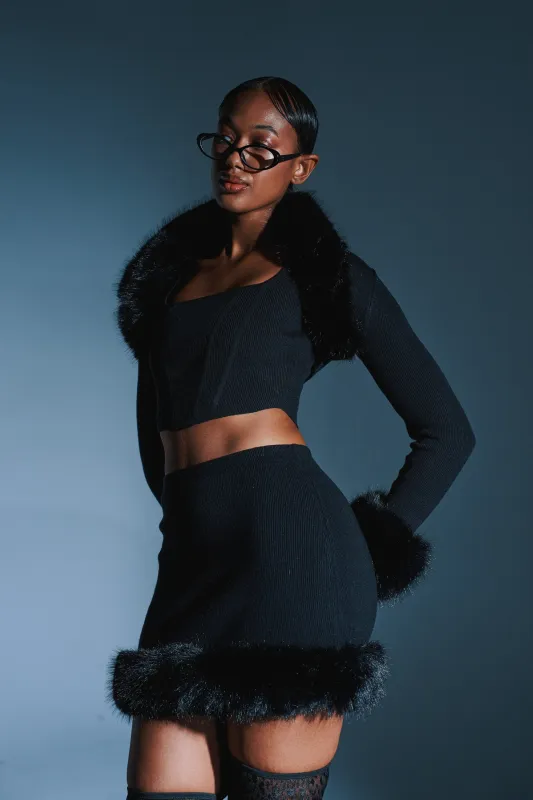 BIG MOOD FUR TRIM MINI SKIRT IN BLACK sold by AKIRA