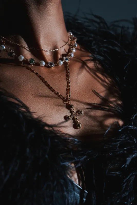 LIKE A PRAYER GOLD CROSS NECKLACE sold by AKIRA
