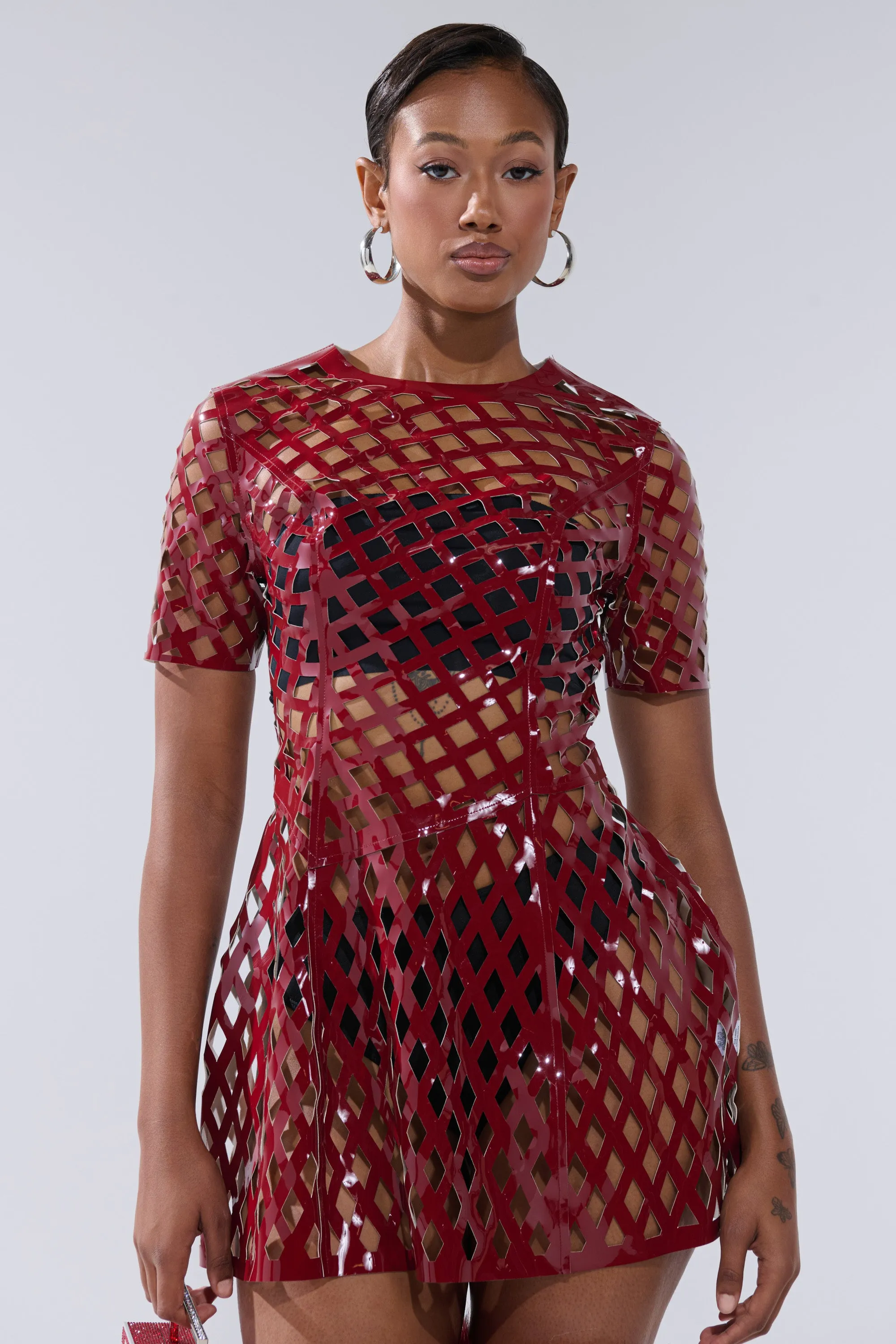 SHE'S DIFFERENT CUT OUT FAUX LEATHER MINI DRESS IN BURGUNDY sold by AKIRA