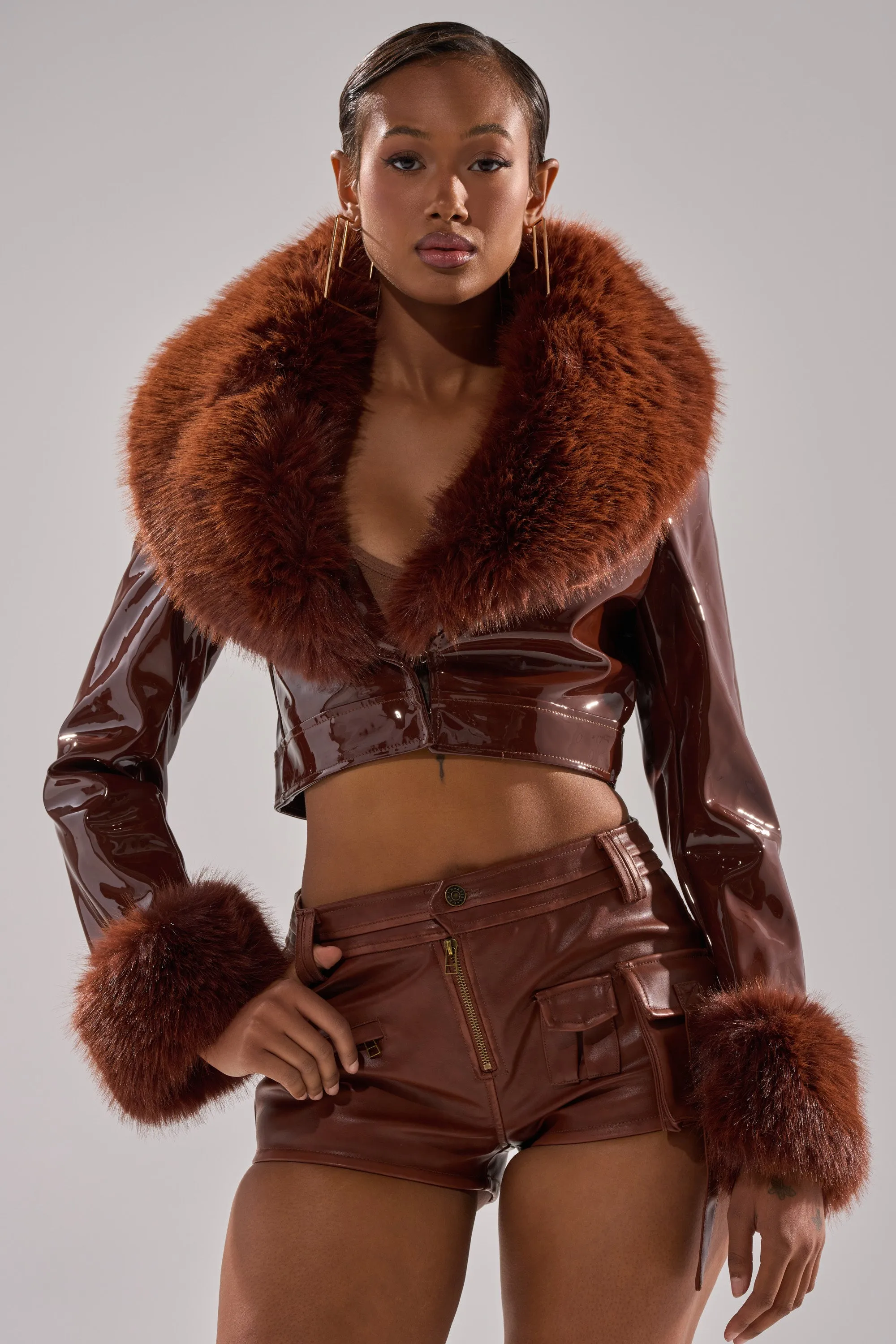 GISELE FUR TRIM MOTO IN PATENT sold by AKIRA