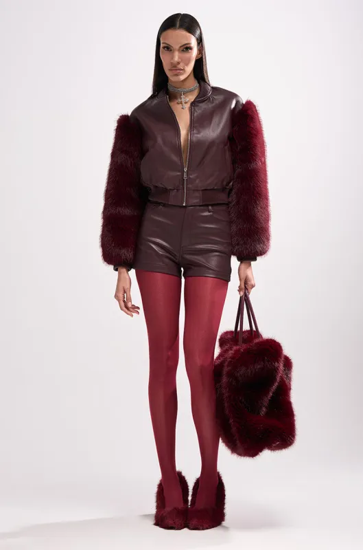 SO GOOD IT HURTS FUR SLEEVE BOMBER IN BURGUNDY sold by AKIRA