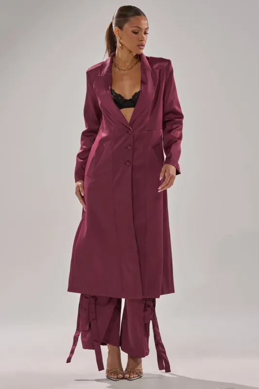 TAKE ME EVERYWHERE SATIN TRENCH IN BURGUNDY sold by AKIRA